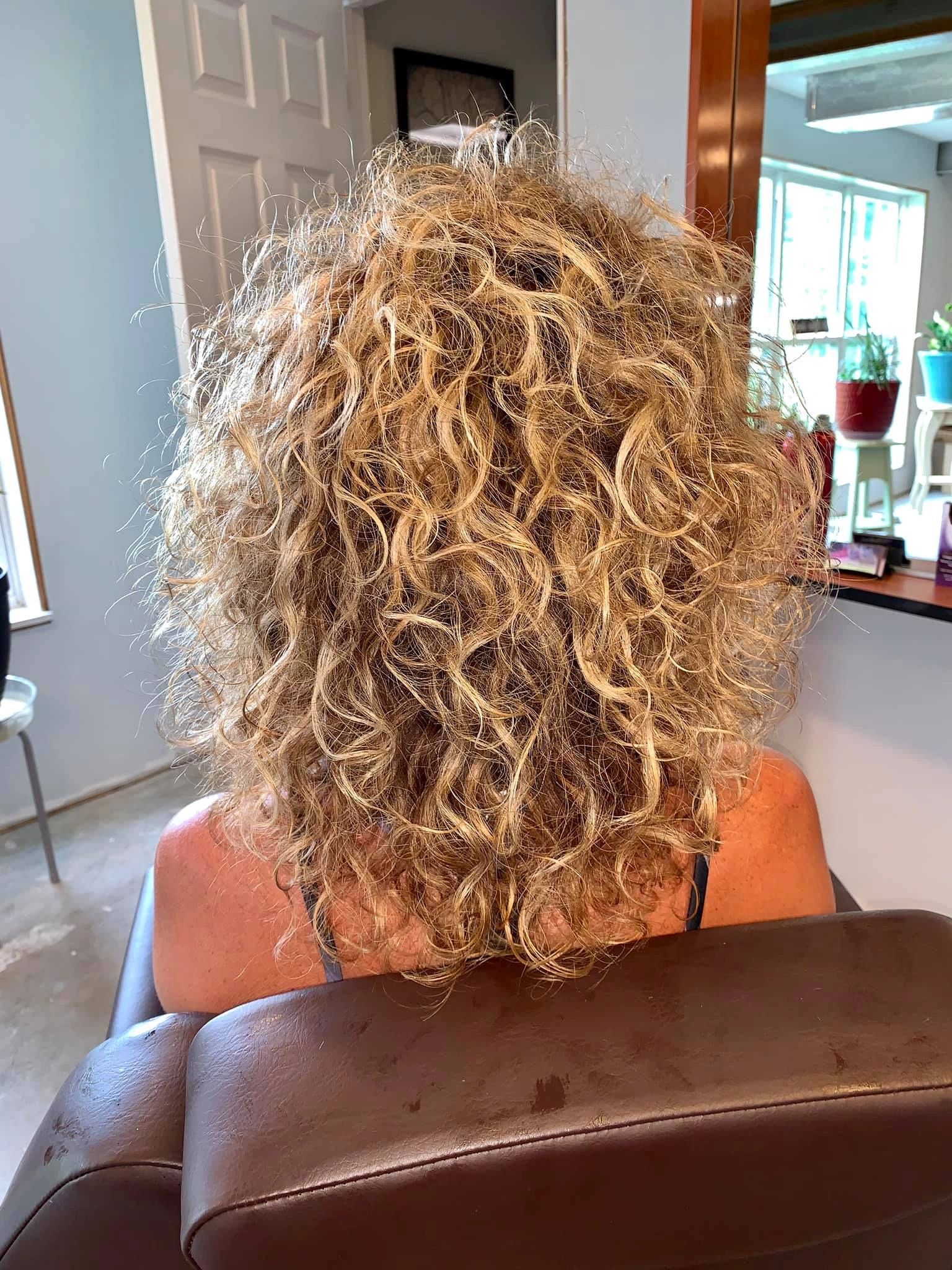 Voluminous curly blonde hair